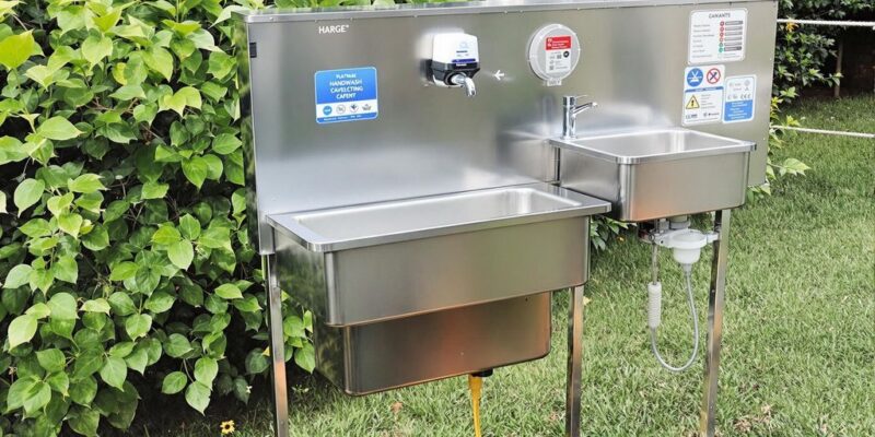 Portable handwash unit for outdoor catering in a garden.
