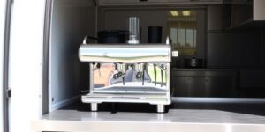 LPG coffee machine being set up in a catering van.