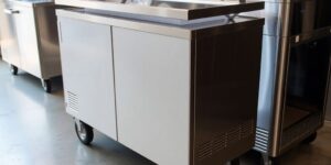 Shiny mobile catering fridges in a professional kitchen.