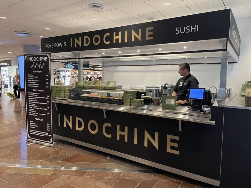 Outdoor mobile food bars with chefs serving customers