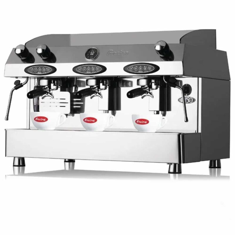 Modern three-group automatic coffee machine on café counter