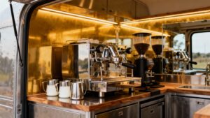 A professional coffee van interior with espresso machines.