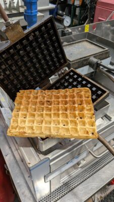 Fracino MULTI LPG waffle maker and griddle producing a golden waffle at a mobile catering event
